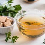 Chicken bouillon cubes, powder, and paste on a wooden cutting board